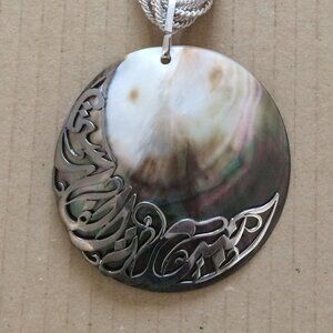 - 26 cms long necklace with circular pendant off white